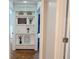 Hallway with built-in shelves displaying decorative items, enhancing the home's charm and functionality at 762 Thompson Ln, Loganville, GA 30052