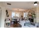 Open-concept living room with modern decor, fireplace, and dining area for comfortable living and entertaining at 762 Thompson Ln, Loganville, GA 30052