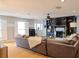 Open living room with a fireplace, built-in shelving, and ample seating space at 762 Thompson Ln, Loganville, GA 30052