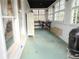 Bright sunroom with multiple windows and eclectic decor at 762 Thompson Ln, Loganville, GA 30052