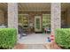 Covered brick patio offers a cozy spot for outdoor seating and relaxation at 9056 Riverbend Mnr, Alpharetta, GA 30022