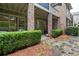 Charming backyard featuring a covered brick patio and well-maintained landscaping at 9056 Riverbend Mnr, Alpharetta, GA 30022
