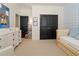 Bright Bedroom with daybed, white dresser and shelving at 9056 Riverbend Mnr, Alpharetta, GA 30022