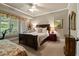 Cozy bedroom featuring a large window with natural light and comfortable furnishings at 9056 Riverbend Mnr, Alpharetta, GA 30022
