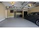 Clean, organized garage featuring overhead storage and a utility sink at 9056 Riverbend Mnr, Alpharetta, GA 30022