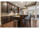 Well-equipped kitchen with dark wood cabinetry, granite countertops, and stainless steel appliances at 9056 Riverbend Mnr, Alpharetta, GA 30022