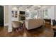 Elegant living room featuring hardwood floors, fireplace, and coffered ceilings at 9056 Riverbend Mnr, Alpharetta, GA 30022