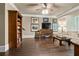 Cozy living room with a ceiling fan, brown tile floors, and elegant furnishings at 9056 Riverbend Mnr, Alpharetta, GA 30022