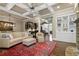 Spacious living room with a fireplace, built-in shelves, and hardwood floors at 9056 Riverbend Mnr, Alpharetta, GA 30022