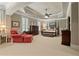 Spacious main bedroom featuring a tray ceiling, comfortable furniture, and ample natural light at 9056 Riverbend Mnr, Alpharetta, GA 30022