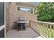 Outdoor patio area with a grill, perfect for entertaining and enjoying outdoor cooking at 9056 Riverbend Mnr, Alpharetta, GA 30022