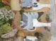 Aerial view of a well-maintained home featuring a spacious driveway and lush landscaping at 1007 Fairway Seven, Villa Rica, GA 30180