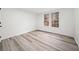 A bright and spacious bedroom with large windows and light colored walls at 1007 Fairway Seven, Villa Rica, GA 30180