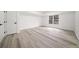 An empty bedroom featuring light colored walls, recessed lighting, a window and a closet at 1007 Fairway Seven, Villa Rica, GA 30180