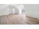 Bright bonus room featuring light wood floors, white walls, and a window for natural light at 1007 Fairway Seven, Villa Rica, GA 30180
