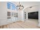 Bright entryway showcasing modern chandelier, wainscoting, and large windows at 1007 Fairway Seven, Villa Rica, GA 30180