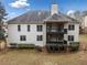 The back of the home features a large two story deck, lots of windows, and a beautiful yard at 1007 Fairway Seven, Villa Rica, GA 30180
