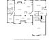 Detailed first floor plan showcasing layout of bedrooms, kitchen, living area, and garage at 1007 Fairway Seven, Villa Rica, GA 30180