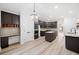 A well-designed kitchen featuring stainless steel appliances, a center island and built in workstation at 1007 Fairway Seven, Villa Rica, GA 30180