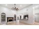 Inviting living room with a fireplace, high ceilings, and light hardwood flooring at 1007 Fairway Seven, Villa Rica, GA 30180