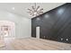 Bright living room with a decorative wall, hardwood flooring, and an open floorplan at 1007 Fairway Seven, Villa Rica, GA 30180