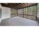 The spacious covered porch overlooks a serene wooded area, offering a tranquil outdoor living space at 1007 Fairway Seven, Villa Rica, GA 30180