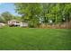 Green backyard featuring a shed and wooden fence providing a private and serene outdoor space at 1792 Center Ave, East Point, GA 30344