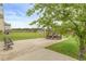 Spacious backyard with a gazebo, patio, manicured lawn, and mature trees at 3039 Tuscan Ridge Dr, Snellville, GA 30039