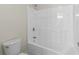Bathroom with a shower-tub combo and white toilet at 3039 Tuscan Ridge Dr, Snellville, GA 30039