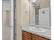A bathroom with a sink, and a door leading to the shower and commode at 3039 Tuscan Ridge Dr, Snellville, GA 30039