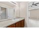Bathroom features a light countertop, wood cabinets, and a view of the bedroom at 3039 Tuscan Ridge Dr, Snellville, GA 30039