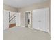 Bedroom with double closets and entry to stairway, showcasing spaciousness at 3039 Tuscan Ridge Dr, Snellville, GA 30039