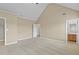 Neutral bedroom featuring a high vaulted ceiling, carpeted floors, and a bright bathroom and closet at 3039 Tuscan Ridge Dr, Snellville, GA 30039