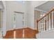 Bright foyer with hardwood floors, a staircase, and natural light at 3039 Tuscan Ridge Dr, Snellville, GA 30039