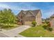 Beautiful two-story brick home with a well-manicured lawn, landscaping and attached two car garage at 3039 Tuscan Ridge Dr, Snellville, GA 30039