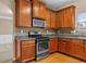 Kitchen with hardwood floors, granite countertops, tile backsplash, and stainless steel appliances at 3039 Tuscan Ridge Dr, Snellville, GA 30039