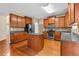 Kitchen with hardwood floors, an island, granite countertops, and stainless steel appliances at 3039 Tuscan Ridge Dr, Snellville, GA 30039