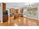 Spacious kitchen with wood cabinets, stainless steel appliances, an island, and hardwood floors at 3039 Tuscan Ridge Dr, Snellville, GA 30039