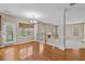 View from kitchen to breakfast room with hardwood floors, white railings, and plenty of natural light at 3039 Tuscan Ridge Dr, Snellville, GA 30039
