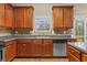 Kitchen with hardwood floors, tile backsplash, an undermount sink, and stainless steel appliances at 3039 Tuscan Ridge Dr, Snellville, GA 30039