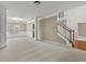 Spacious living room with carpeted floors, modern lighting, and an open staircase at 3039 Tuscan Ridge Dr, Snellville, GA 30039