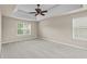 Spacious main bedroom with tray ceiling and plush carpet at 3039 Tuscan Ridge Dr, Snellville, GA 30039