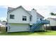 Exterior of a white house with a blue deck and green lawn at 5683 Isleworth Way, Atlanta, GA 30349