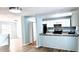 Bright kitchen with granite countertops, modern appliances, tile backsplash and ample cabinet space, open to the living area at 5683 Isleworth Way, Atlanta, GA 30349