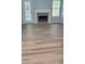 Inviting living room features new wood floors, a cozy fireplace, natural light, and an easy access to backyard patio at 5683 Isleworth Way, Atlanta, GA 30349