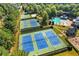 Aerial view of community tennis courts, swimming pool and clubhouse at 5725 Lake Oak Lndg, Cumming, GA 30040