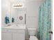 Bathroom with a single sink, vanity and patterned shower curtain at 5725 Lake Oak Lndg, Cumming, GA 30040