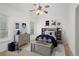Stylish bedroom with a bed, dresser, and playful decor at 5725 Lake Oak Lndg, Cumming, GA 30040