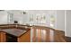 Breakfast Nook featuring hardwood floors, access to the deck, and opening to kitchen at 5725 Lake Oak Lndg, Cumming, GA 30040