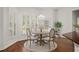 Breakfast nook features natural light and hardwood floors at 5725 Lake Oak Lndg, Cumming, GA 30040